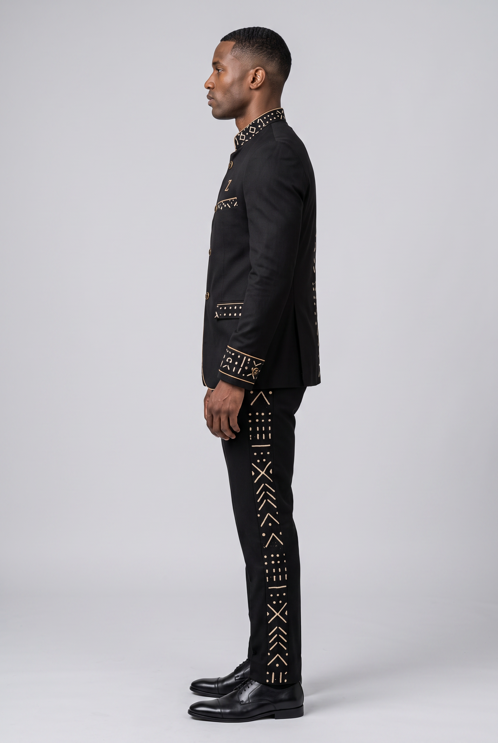 Redefined Heritage Suit · Onyx Black — Men, 02 Left (view 2 of 7). Left profile: shoulder line, sleeve fall and the outer seam trim.