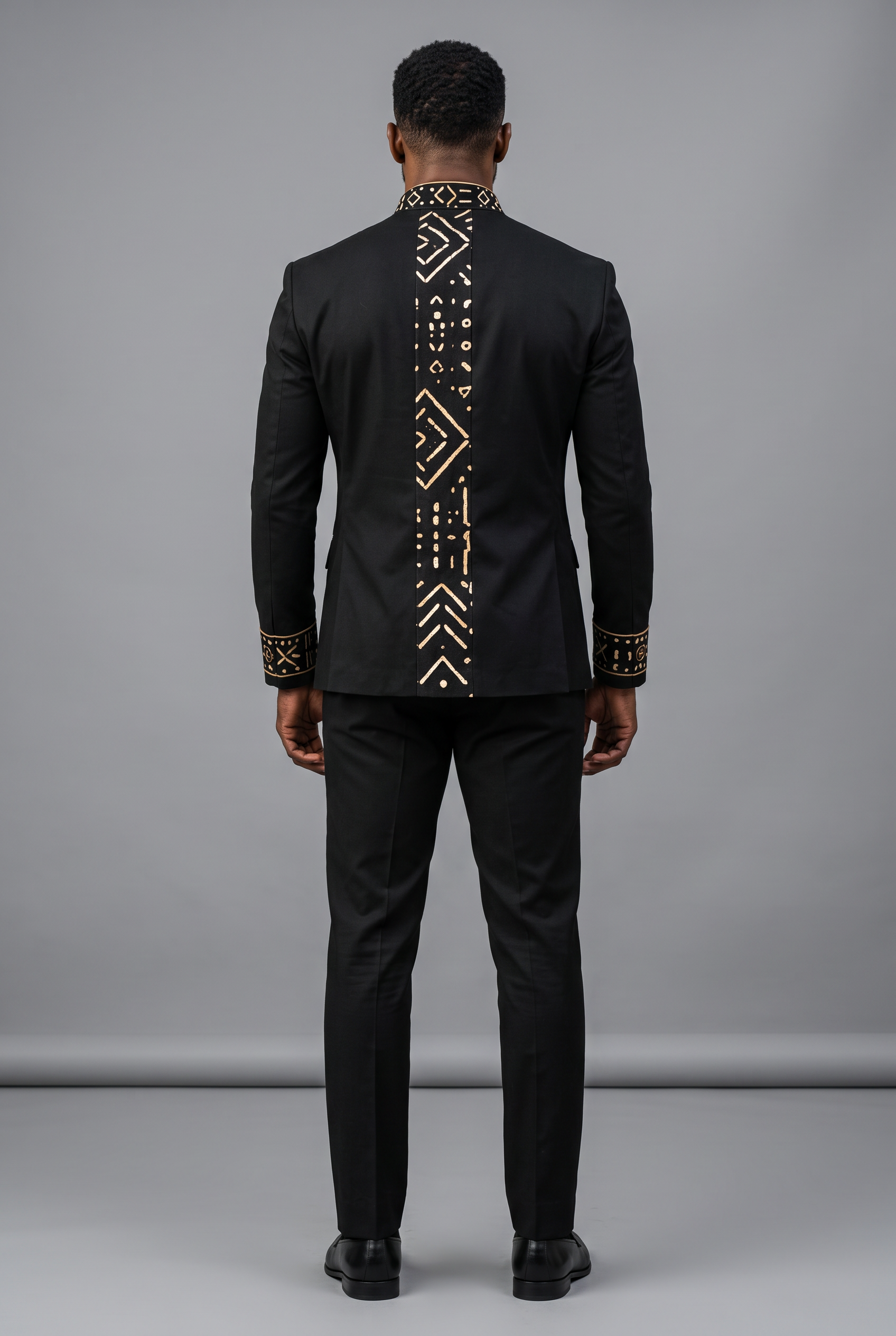 Redefined Heritage Suit · Onyx Black — Men, 04 Back (view 4 of 7). Back view: yoke, centre seam and the hem finish.