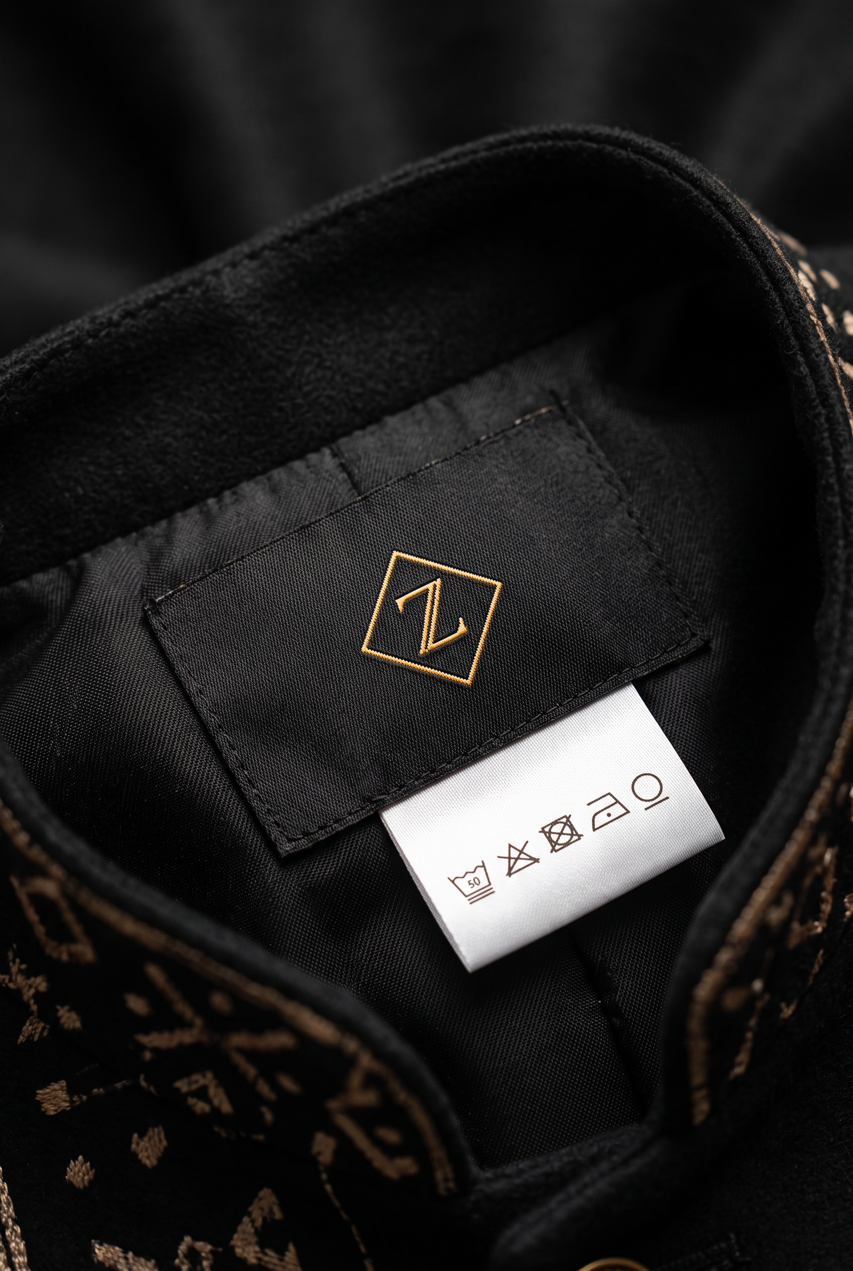 Bogolan Atelier Jacket · Onyx Black — Men, 06 Inner tags (view 6 of 7). Inner tags: size scale, atelier reference and care instructions.