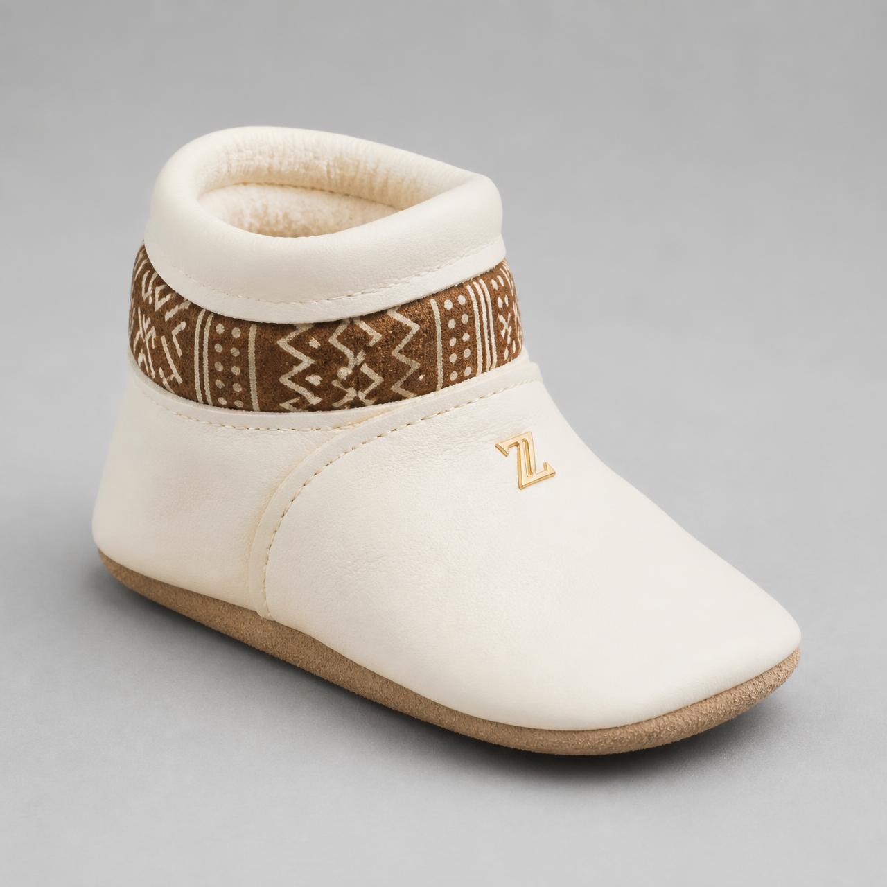First Step Bootie Slipper · Baby — Boys — House · Z-Vibe Luxury Slippers™ seven-view specification plate; showing 01 Front, 02 Left, 03 Right, 04 Back, 05 Interior, 06 Inner tags, 07 Fabric detail. — 01 Front, Ivory / Brown Bogolan
