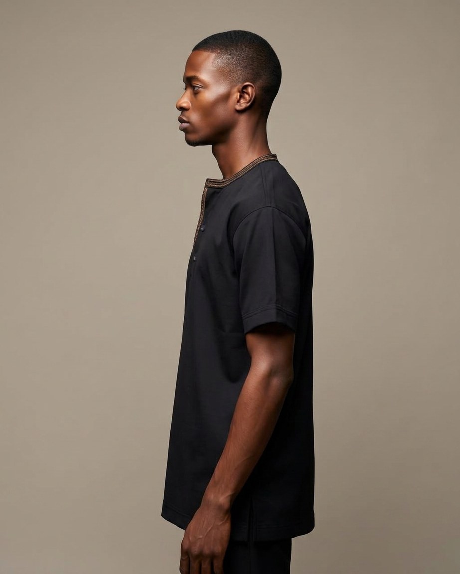 Black Legacy Tee — Men, 02 Left (view 2 of 7). Left profile: shoulder line, sleeve fall and the outer seam trim.