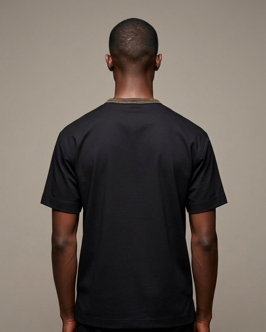 Black Legacy Tee — Men, 04 Back (view 4 of 7). Back view: yoke, centre seam and the hem finish.