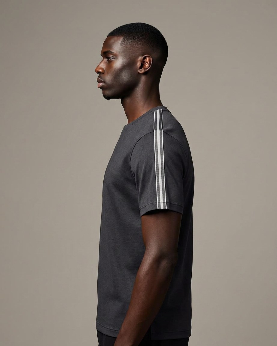 Bogolan Edge Tee — Men, 02 Left (view 2 of 7). Left profile: shoulder line, sleeve fall and the outer seam trim.