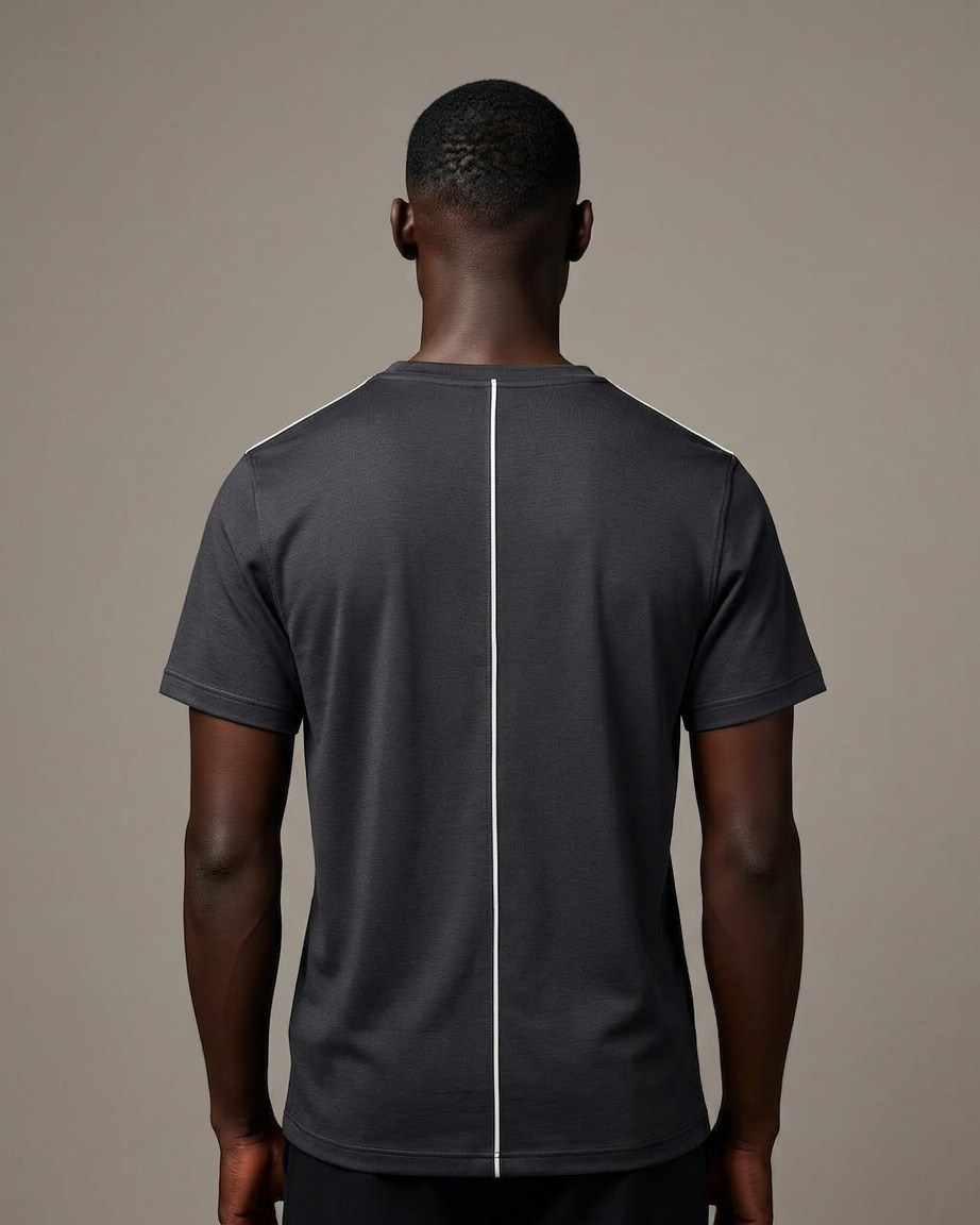 Bogolan Edge Tee — Men, 04 Back (view 4 of 7). Back view: yoke, centre seam and the hem finish.