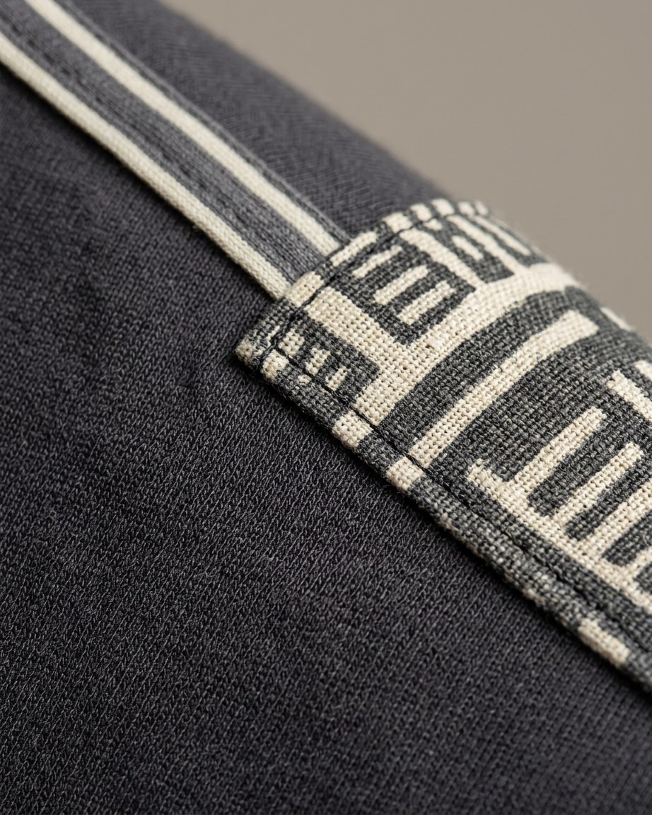 Bogolan Edge Tee — Men, 07 Fabric detail (view 7 of 7). Fabric detail: close study of the cloth, hand-printed mudcloth motif and stitching.
