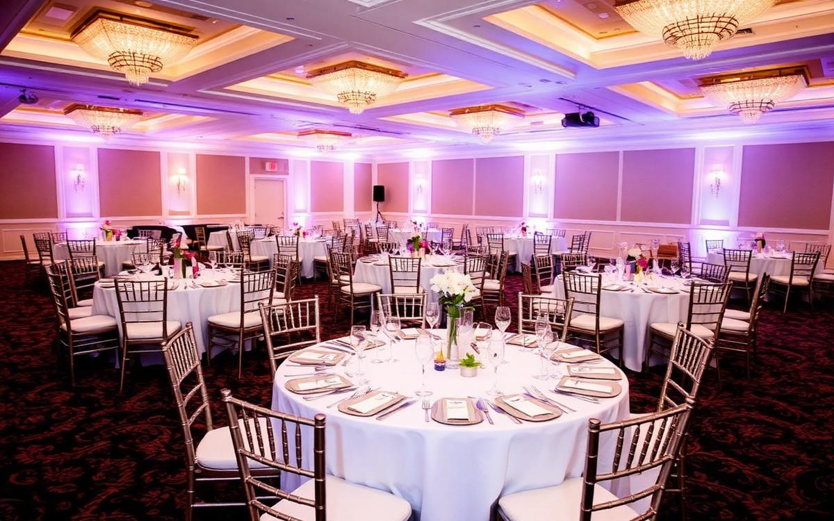 Banquet tables and chiavari chairs set for a ballroom reception