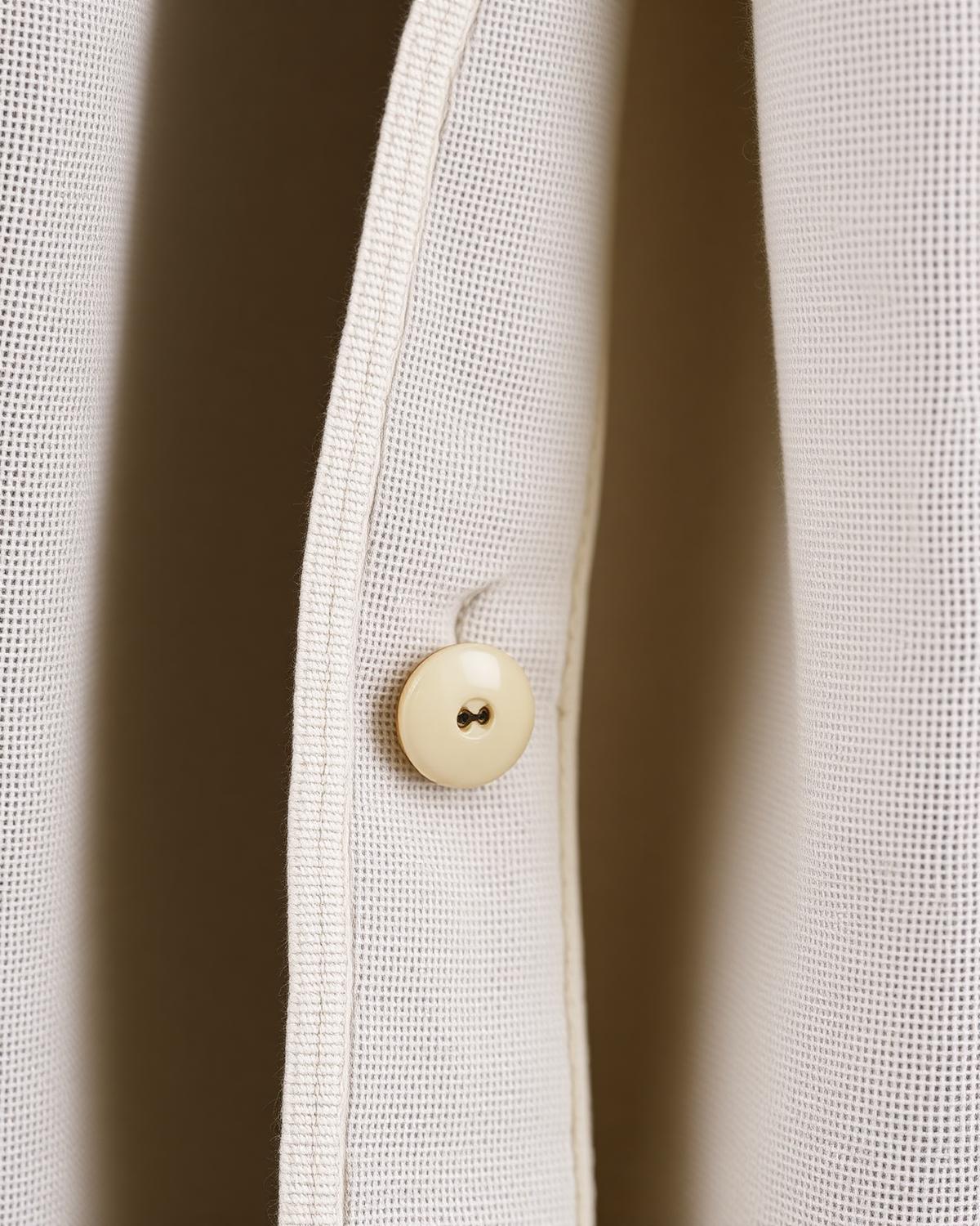 Heritage Notch Shirt — Men, 07 Fabric detail (view 7 of 7). Fabric detail: close study of the cloth, hand-printed mudcloth motif and stitching.