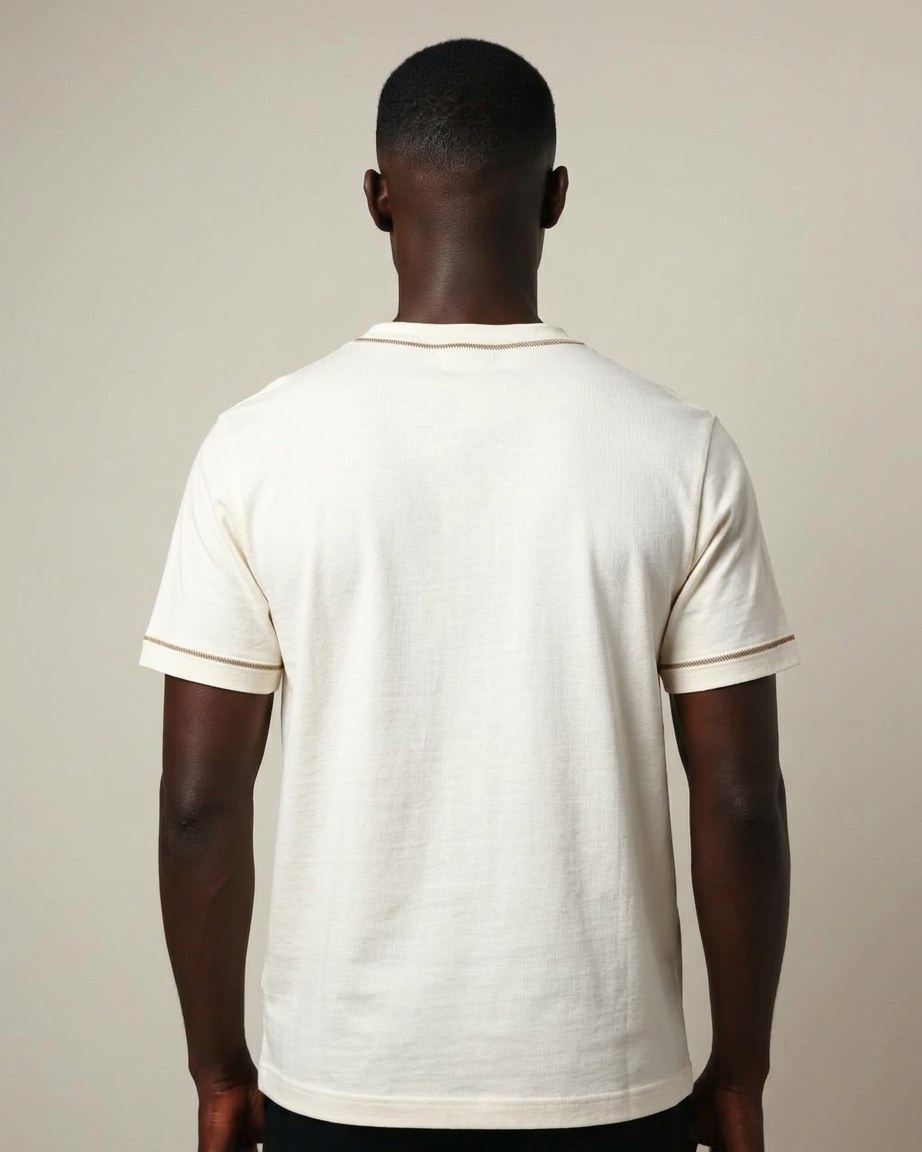 Ivory Legacy Tee — Men, 04 Back (view 4 of 7). Back view: yoke, centre seam and the hem finish.