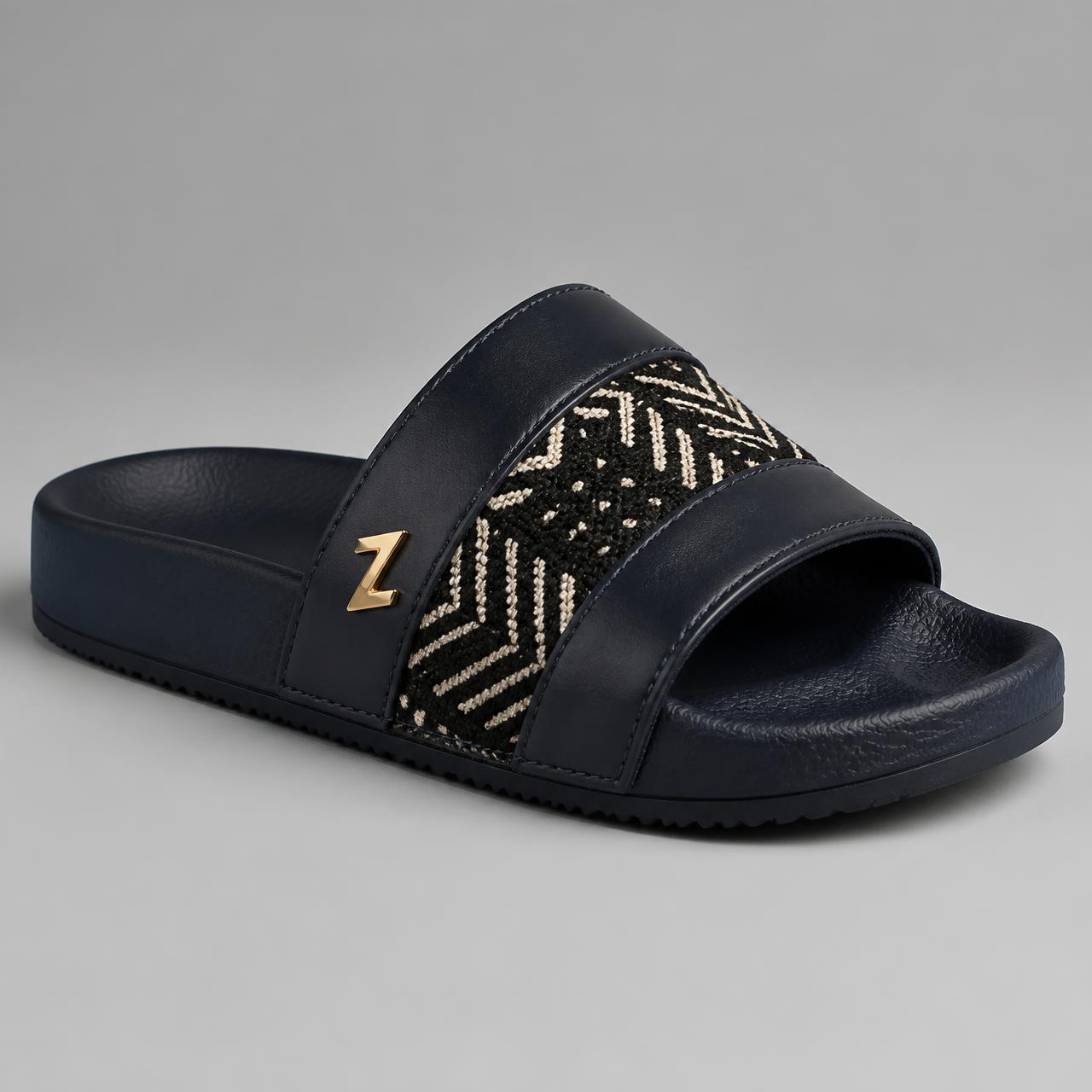 Explorer Heritage Slide · Boys — Boys — House · Z-Vibe Luxury Slippers™ seven-view specification plate; showing 01 Front, 02 Left, 03 Right, 04 Back, 05 Interior, 06 Inner tags, 07 Fabric detail. — 01 Front, Navy / Ivory Bogolan