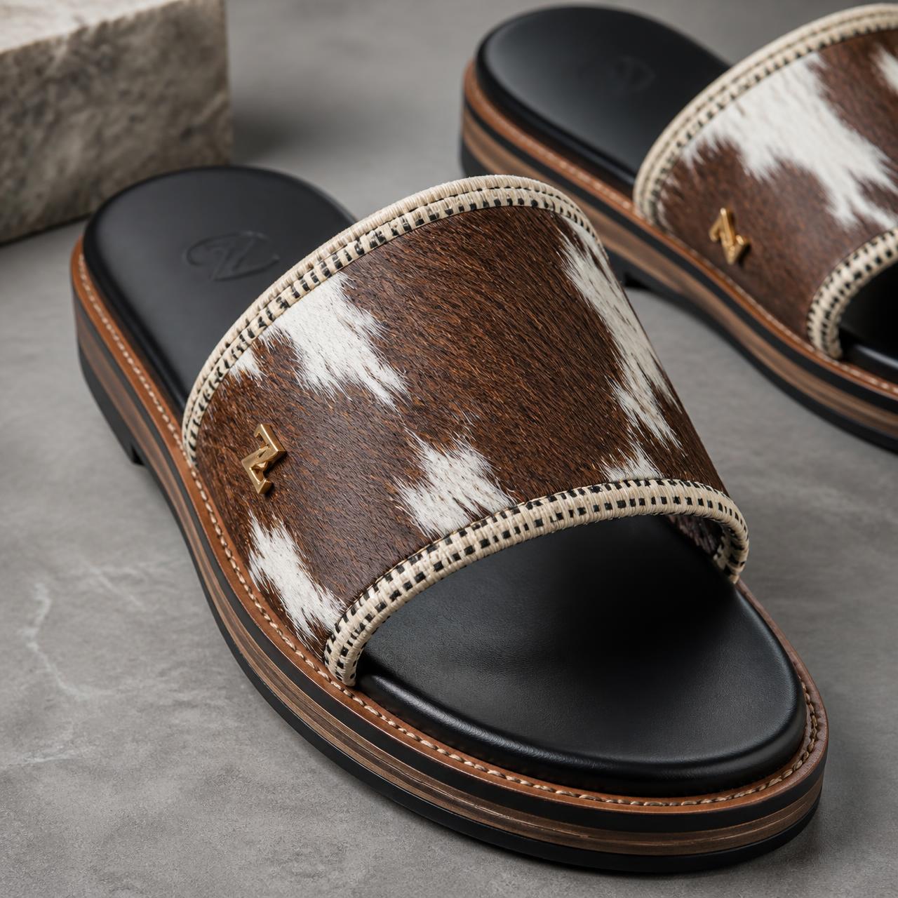 Nomad Hair-On-Hide Slide — Men — House · Z-Vibe Luxury Slippers™ seven-view specification plate; showing 01 Front, 02 Left, 03 Right, 04 Back, 05 Interior, 06 Inner tags, 07 Fabric detail. — 01 Front, Chestnut Hide / Ivory Bogolan