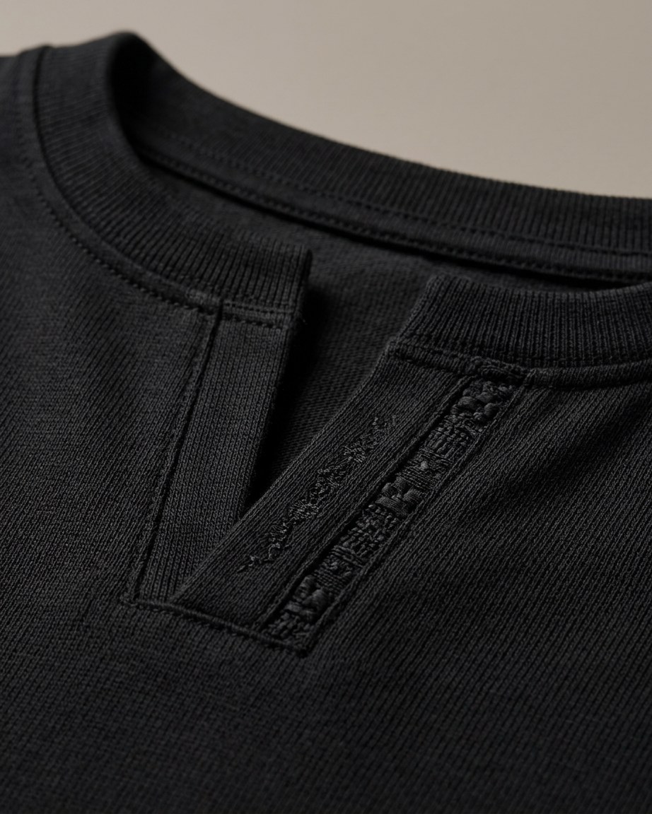 Midnight Culture Tee — Men, 07 Fabric detail (view 7 of 7). Fabric detail: close study of the cloth, hand-printed mudcloth motif and stitching.