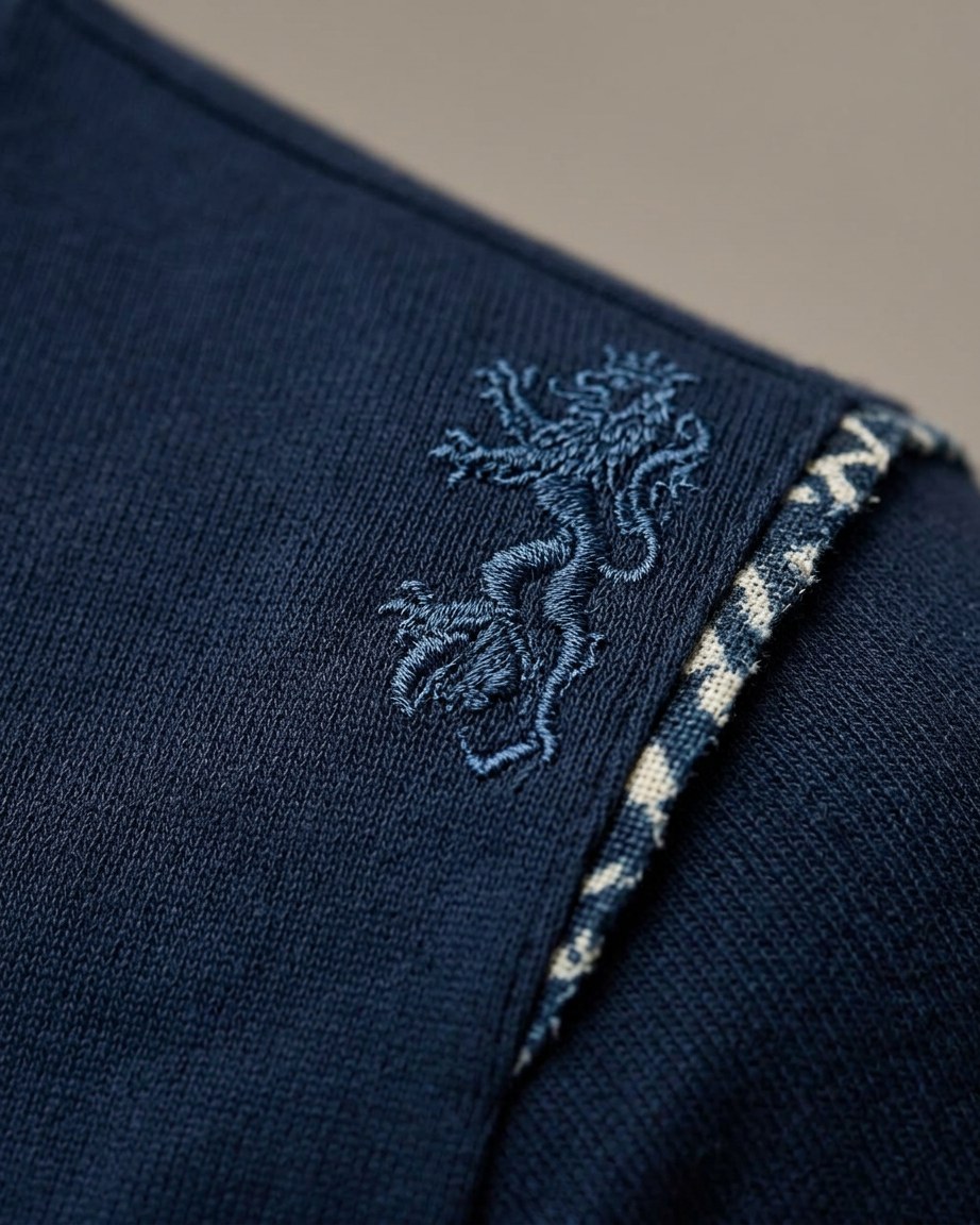 Navy Prestige Tee — Men, 07 Fabric detail (view 7 of 7). Fabric detail: close study of the cloth, hand-printed mudcloth motif and stitching.