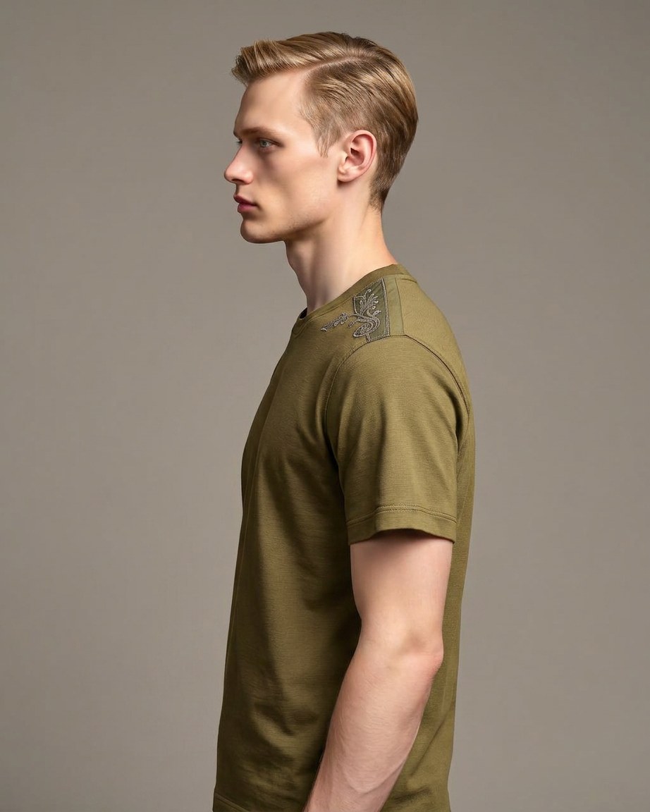 Olive Pride Tee — Men, 02 Left (view 2 of 7). Left profile: shoulder line, sleeve fall and the outer seam trim.