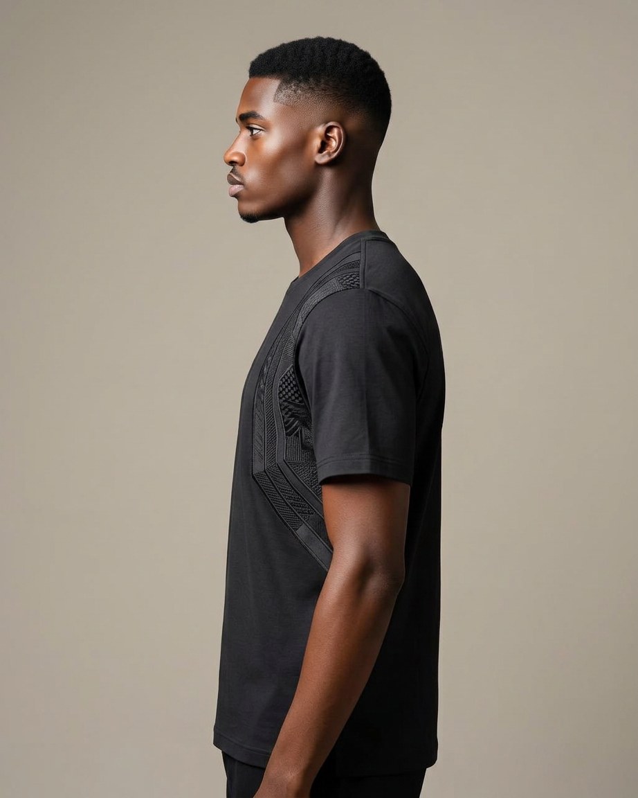 Onyx Heritage Tee — Men, 02 Left (view 2 of 7). Left profile: shoulder line, sleeve fall and the outer seam trim.