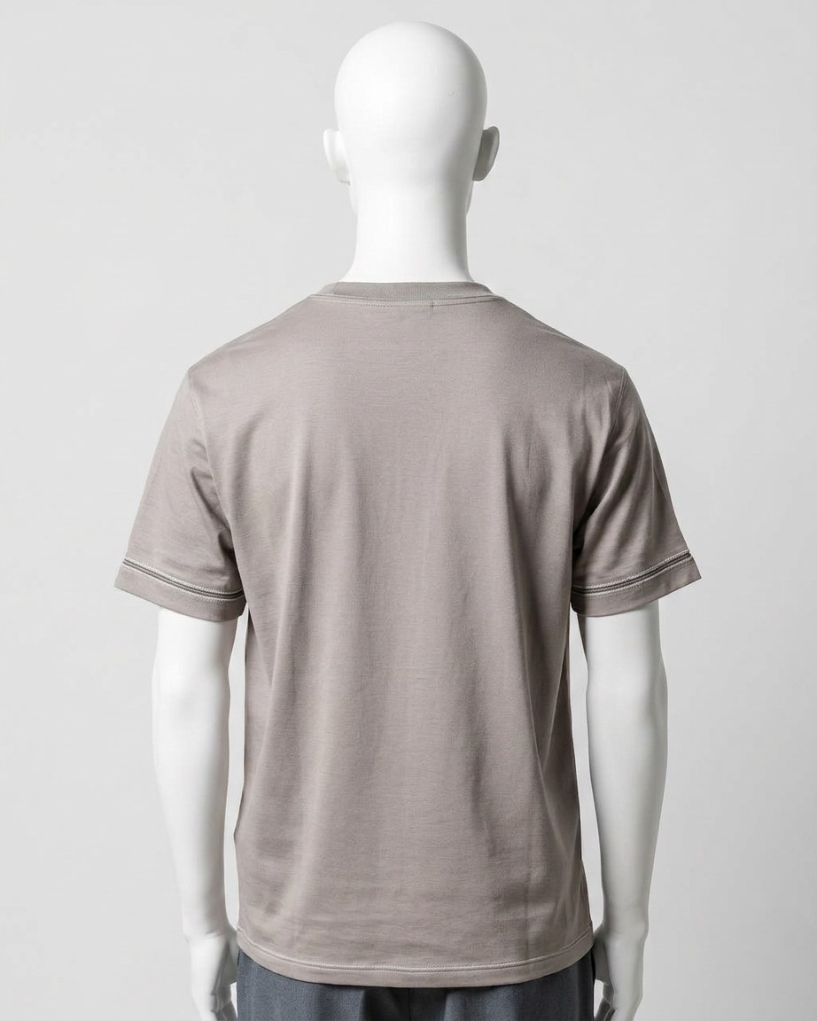 Stone Grey Tee — Men, 04 Back (view 4 of 7). Back view: yoke, centre seam and the hem finish.