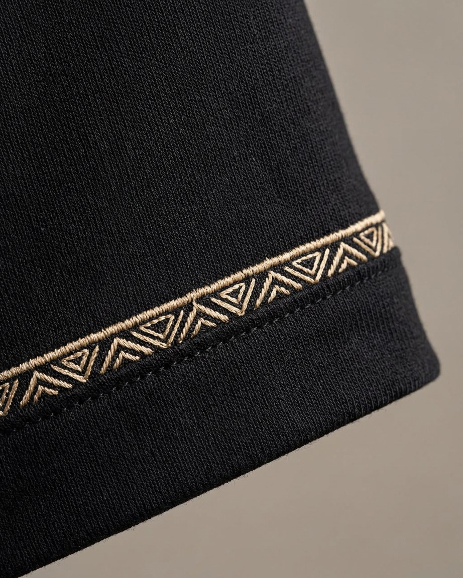 Urban Minimal Tee — Men, 07 Fabric detail (view 7 of 7). Fabric detail: close study of the cloth, hand-printed mudcloth motif and stitching.