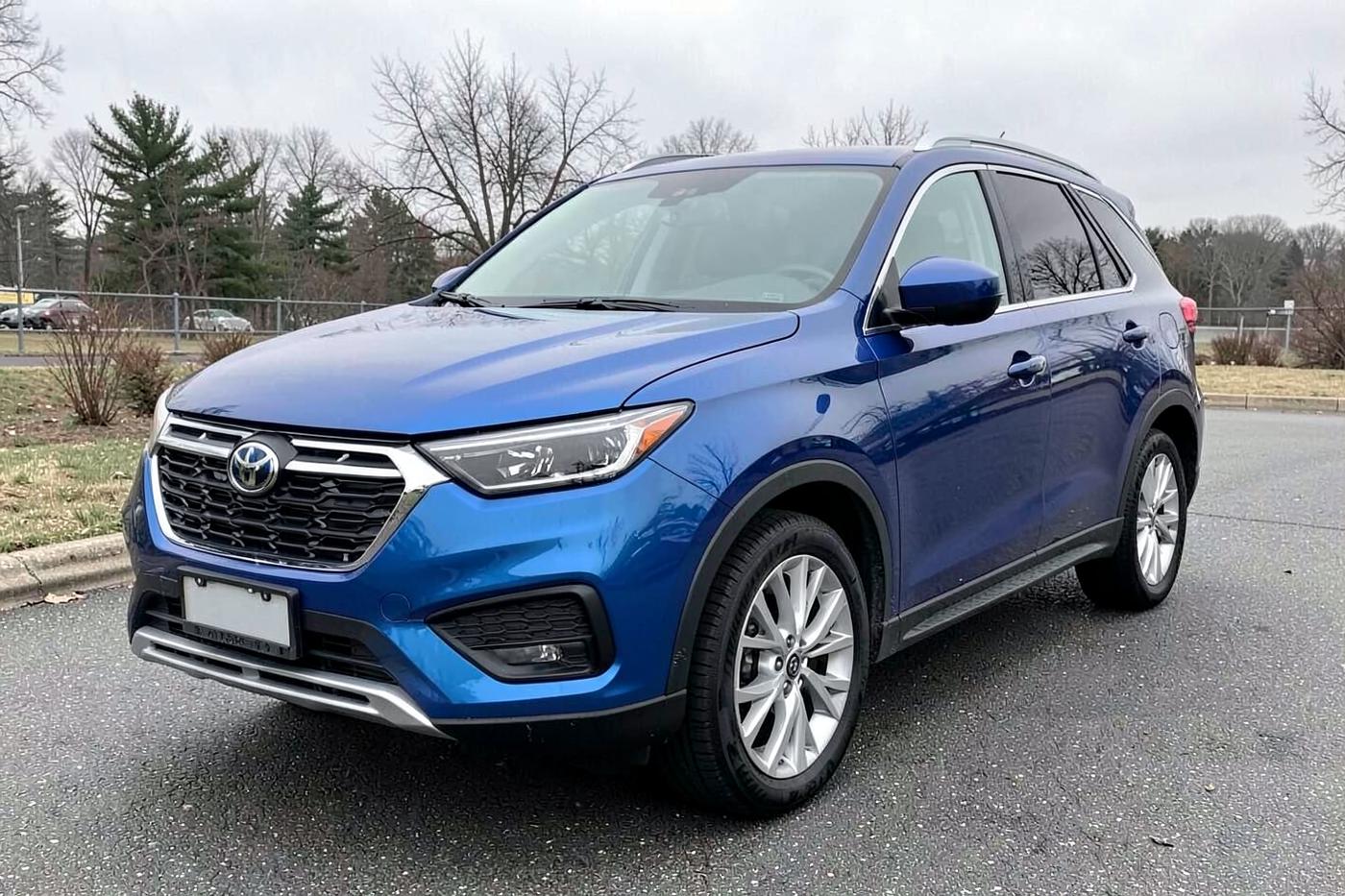 Blue Corso Ridge hybrid SUV photographed on asphalt under overcast light