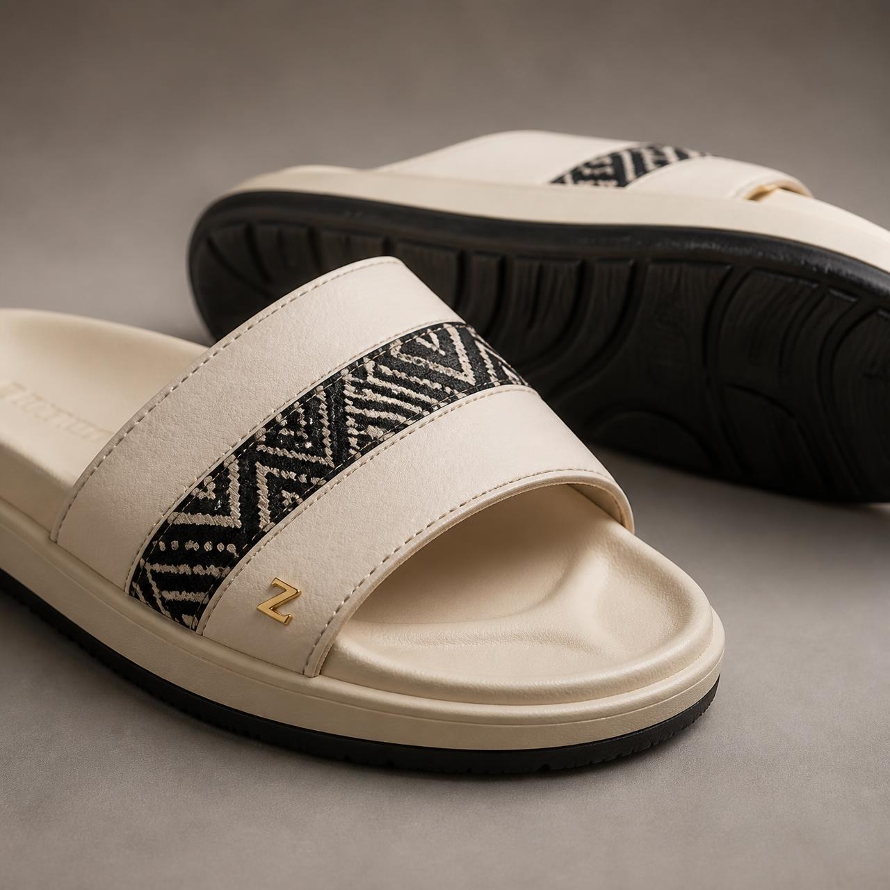 Heritage Step Comfort Slide — Women — House · Z-Vibe Luxury Slippers™ seven-view specification plate; showing 01 Front, 02 Left, 03 Right, 04 Back, 05 Interior, 06 Inner tags, 07 Fabric detail. — 01 Front, Ivory / Black Bogolan