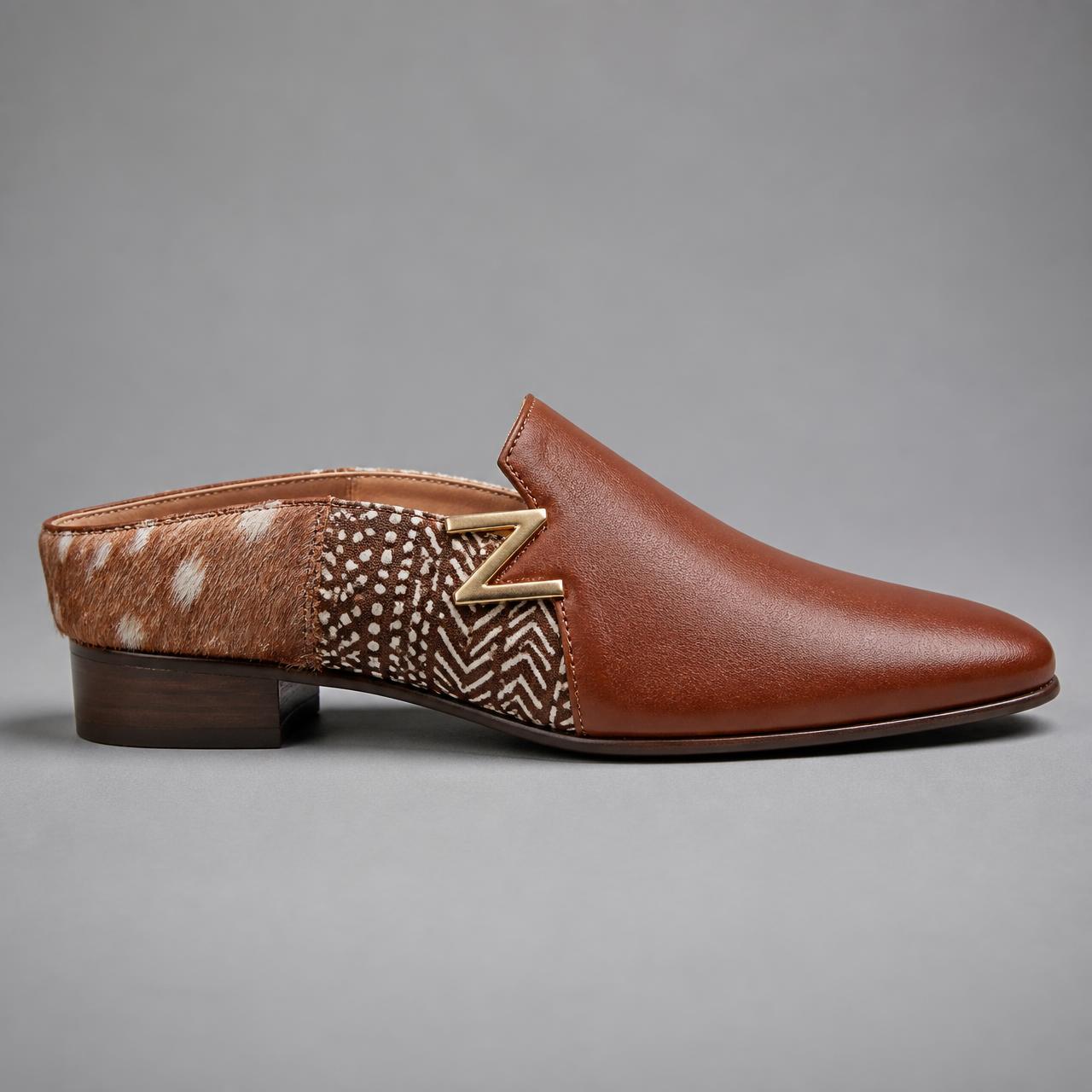 Royal Cowhide Mule — Women — House · Z-Vibe Luxury Slippers™ seven-view specification plate; showing 01 Front, 02 Left, 03 Right, 04 Back, 05 Interior, 06 Inner tags, 07 Fabric detail. — 01 Front, Cognac / Brown Bogolan