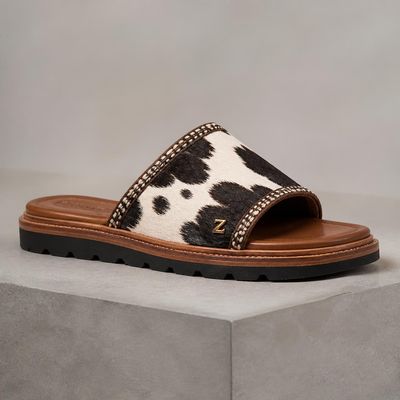 Sovereign Hair-On-Hide Slide — Women — House · Z-Vibe Luxury Slippers™ seven-view specification plate; showing 01 Front, 02 Left, 03 Right, 04 Back, 05 Interior, 06 Inner tags, 07 Fabric detail. — 01 Front, Monochrome Hide / Ivory Bogolan