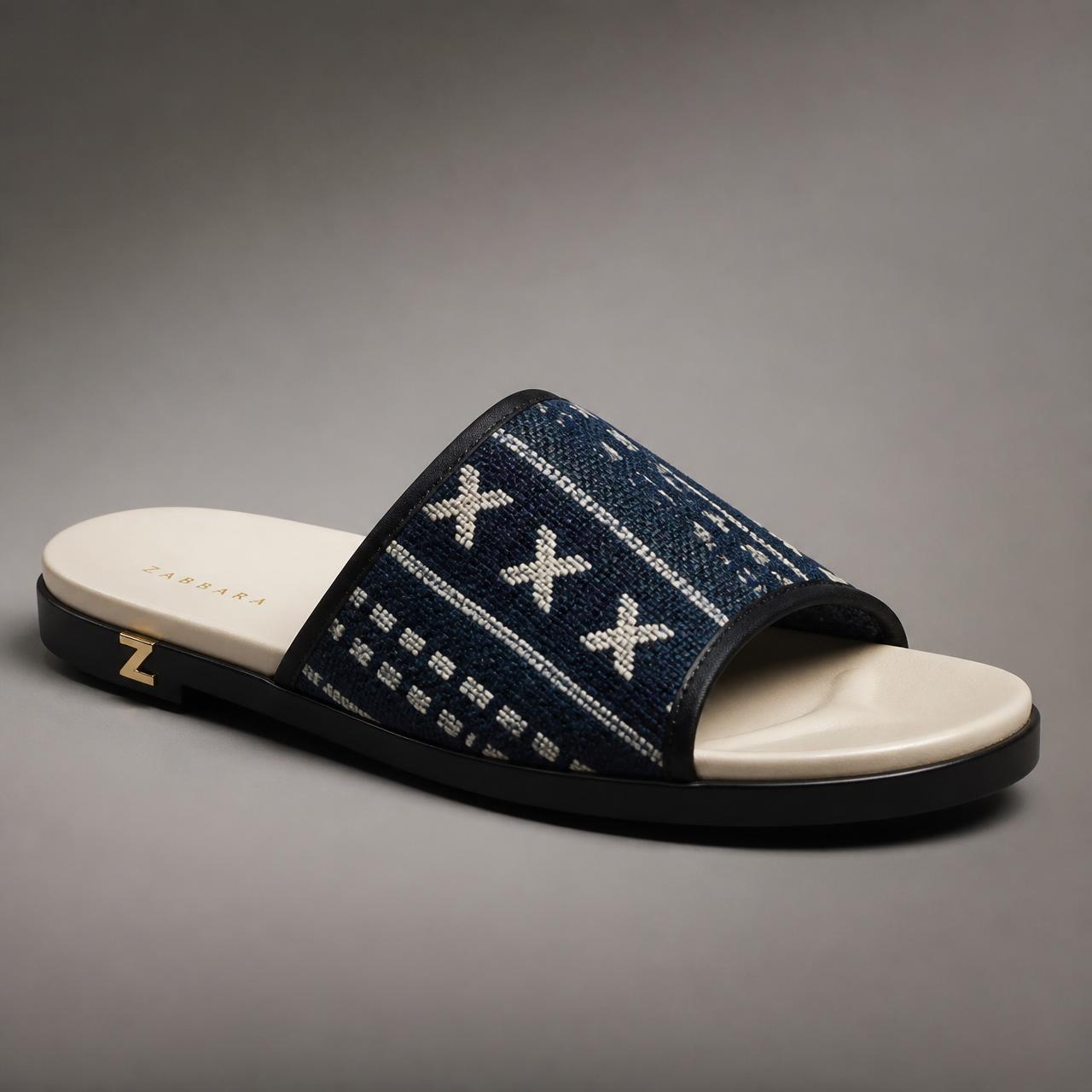 Unity Bogolan Slide — Women — House · Z-Vibe Luxury Slippers™ seven-view specification plate; showing 01 Front, 02 Left, 03 Right, 04 Back, 05 Interior, 06 Inner tags, 07 Fabric detail. — 01 Front, Indigo / Ivory